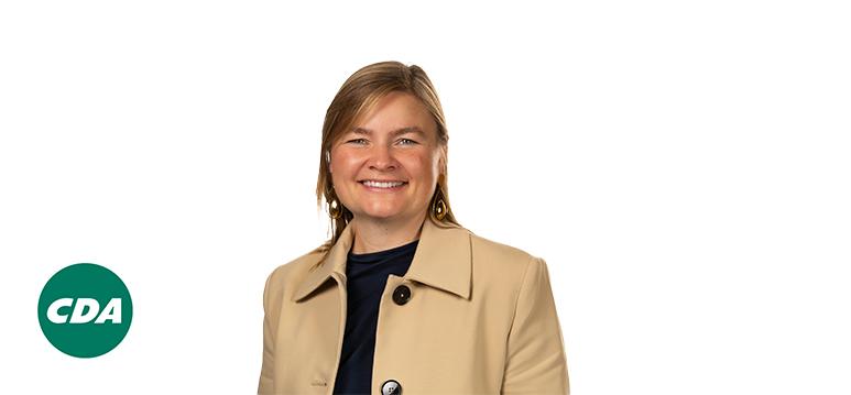 Portrait of  van Ark with logo CDA.