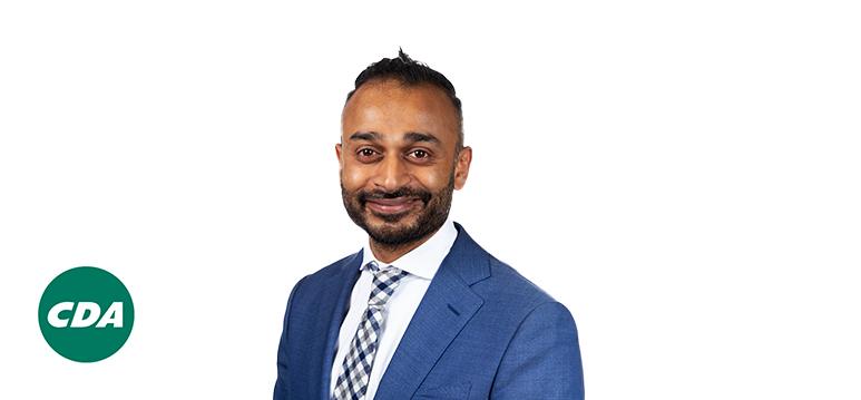 Portrait of Hamstra with logo CDA.