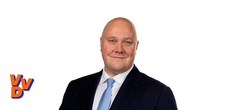 Portrait of Aartsen with logo VVD.