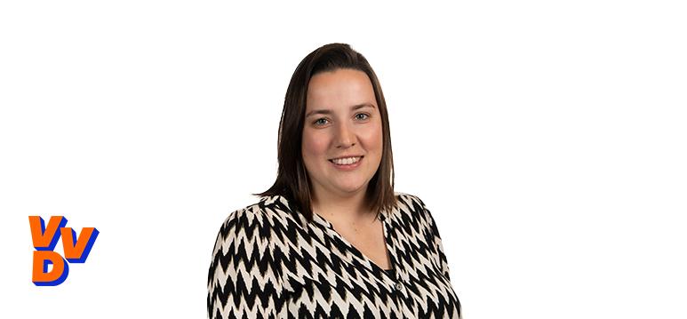 Portrait of Wendel with logo VVD.