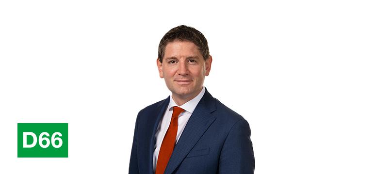 Portrait of Paternotte with logo D66.