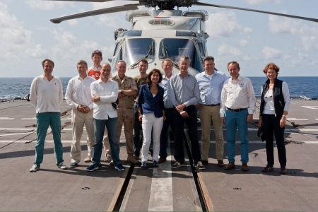 Chairmen in front of a helicopter