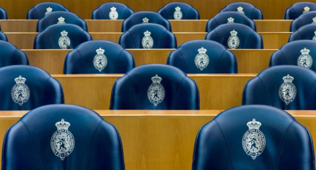Blue chairs in the plenary Hall